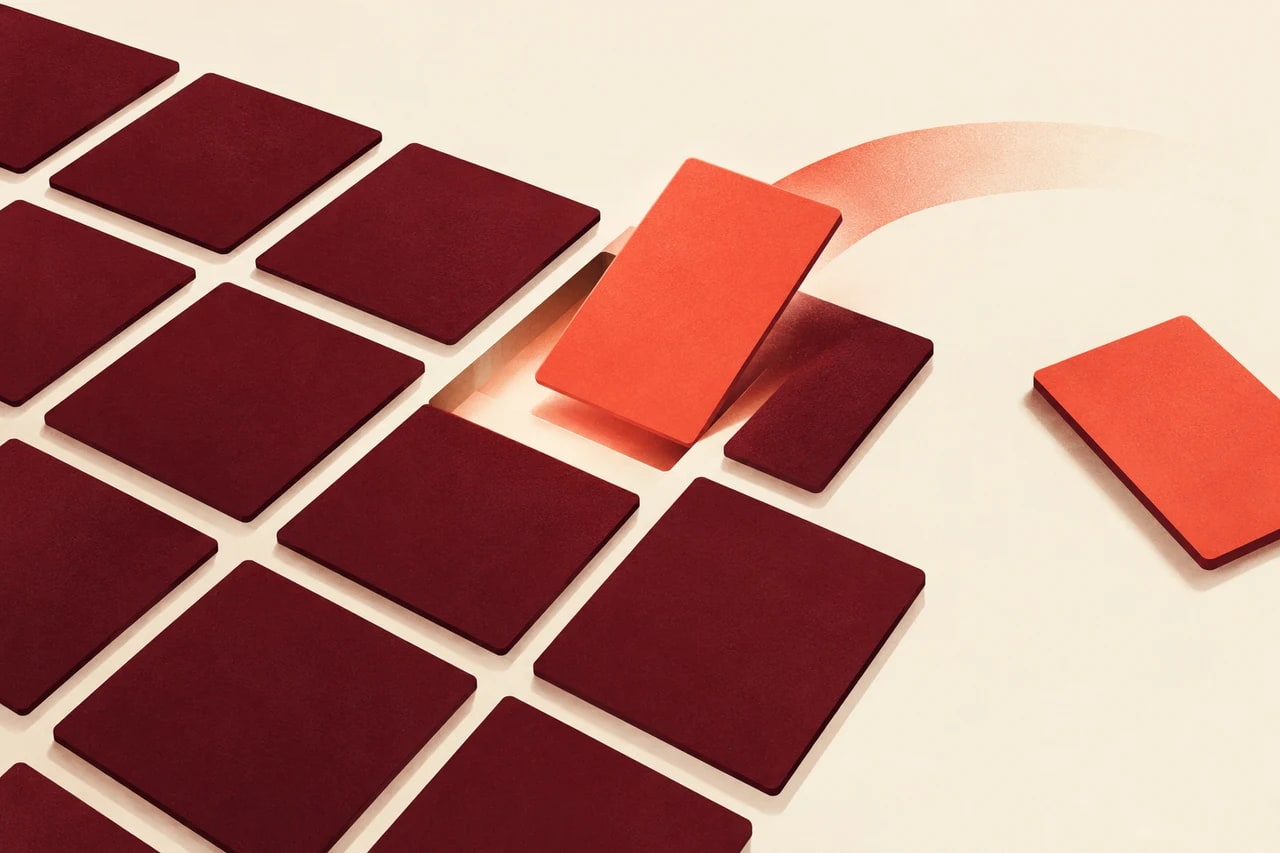 A coral card moves into its matching slot in a burgundy grid while another card stays outside.